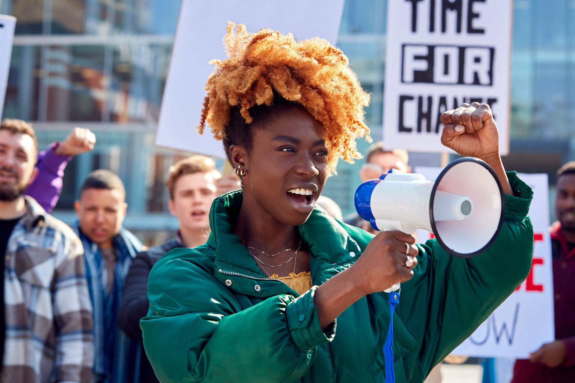 Protestors With Placards And Megaphone On protests Demonstration March Against Racism